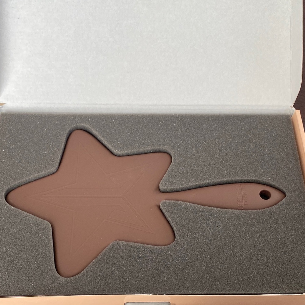 Jeffree Star Chocolate brown hand mirror.